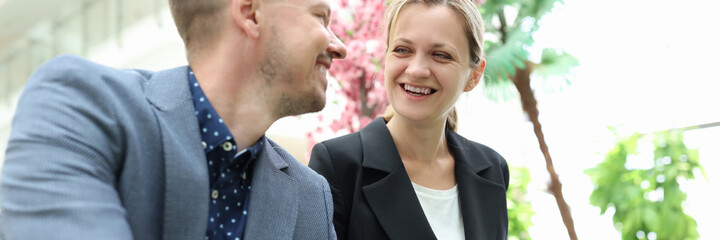 Smiling businessman is discussing business project with businesswoman