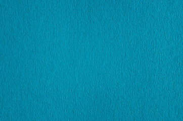 Textured background of blue paper close-up, macro photography detailed paper uneven texture. Blank copy space