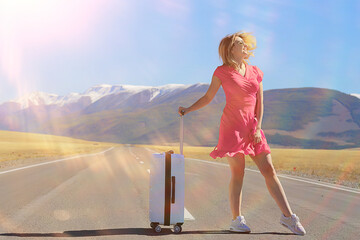 sexy girl in dress with suitcase on the highway, summer travel freedom, woman tourist