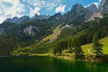Fototapeta na wymiar Gosausee - Beautiful lake in the mountains in Austria. Under the Dachstein mountains. Popular tourist place in the Alps.
