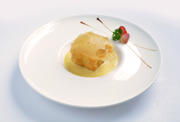 deep fried crispy golden premium durian dessert with yellow sauce in white background asian halal menu