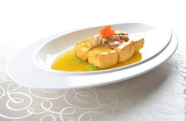 braised handmade bean curd tofu with crabmeat, luffa plant, roe in golden yellow sauce in white background asian halal menu