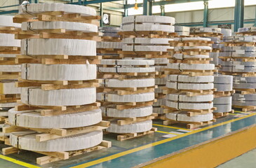 Roll steel coil, steel sheet in factory warehouse, metal sheet industry, warehouse, safety walk way