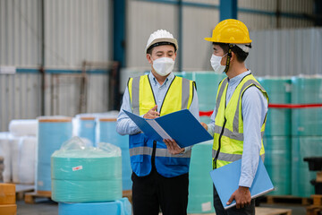 asian supervisor engineer manufacturing wearing face mask talking for technician worker line manufacture at workshop mask industrial.