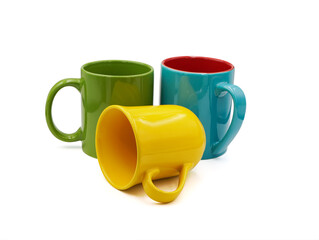 group of Colorful ceramic coffee cup in yellow , green , blue isolated on white background