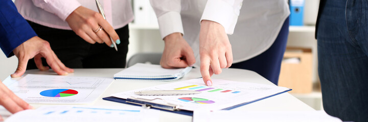 Female hand point finger to graph