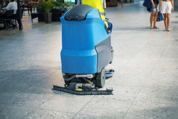 Modern floor cleaning machine at airport or railway station.