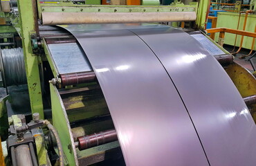 Two Rolled steel sheet coil slitting process in factory - obrazy, fototapety, plakaty