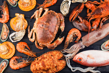 Seafood dinner, seafood dinner with fresh lobster, crab, mussel and oyster as background