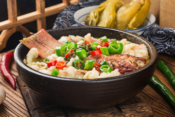 Chinese food:boiled fish with pickled cabbage and chili. Red grouper fillets