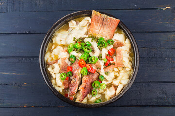 Chinese food:boiled fish with pickled cabbage and chili. Red grouper fillets