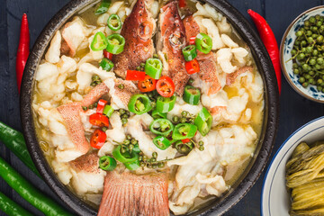 Chinese food:boiled fish with pickled cabbage and chili. Red grouper fillets