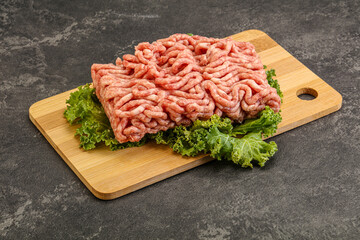 Raw pork minced meat over board