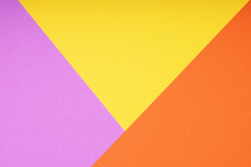 colorful paper background with triangle pattern in pink yellow and orange