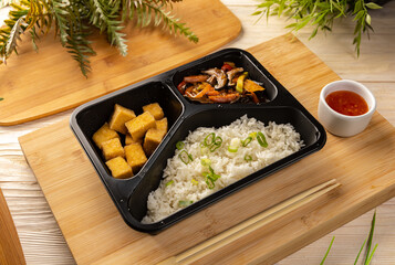Fototapeta na wymiar Rice with tofu and vegetable stew