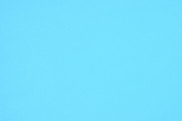 Solid blue paper background and texture for your text and design.