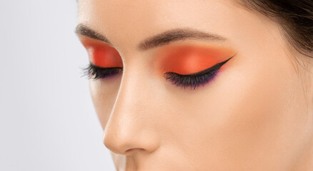 Beautiful woman with long eyelashes, beautiful make-up and thick eyebrows. Professional makeup and...