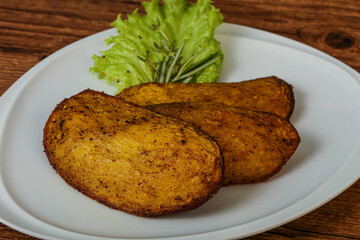 Baked potato with herbs and spices