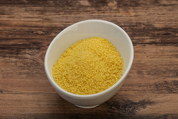 Raw cous cous heap in the bowl