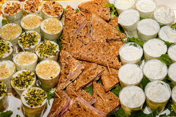 Assorted appetizers with cheese, bread, ham and vegetables