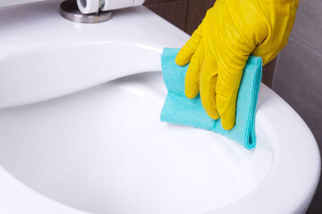 Cleaning  rimless toilet close-up