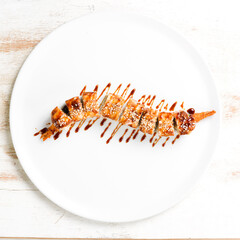 Sushi rolls with shrimp. Traditional Japanese food. Top view. On a white background.