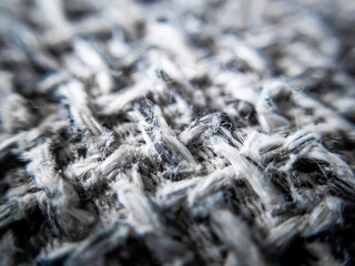 selective focus fabric texture on macro fabric sofa background image texture gray pattern interspersed with black