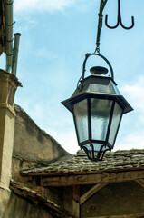 Fototapeta na wymiar Public lighting fixture in old town centre, Sighisoara, Romania