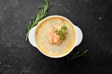 Fish soup with vegetables. Soup in a bowl. Top view. Free space for your text.