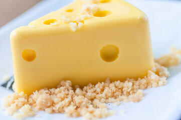 Cheese cake with cream custard with crispy cookie serve on white plate.