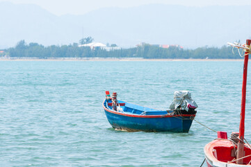 Fototapeta na wymiar Local fishing boat floating on the sea