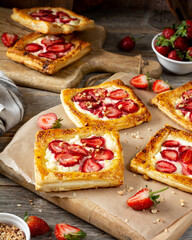 Puffs with cheese cream and strawberries. Delicious homemade sweet pastries