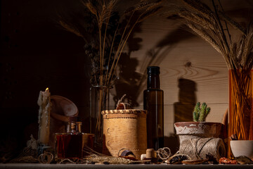 Fantasy still life. Potion bottles, candle, medicine, broken amphora. Ingredients for making the potion.