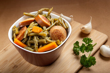 Beans with pork sausages stew