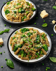 Green peas, broccoli pasta with pesto sauce and parmesan cheese. healthy food.