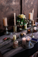 Fortune telling on tarot cards, candles for magic rituals.
