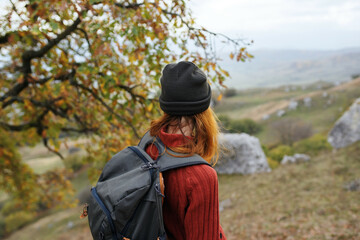 woman hiker with backpack travel mountains nature lifestyle