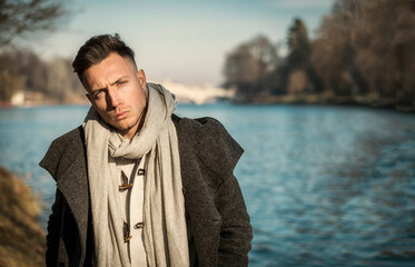 One handsome young man in urban setting in European city