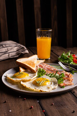 American breakfast with eggs and bacon