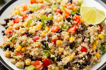 Quinoa black bean salad with corn, red green pepper, onion. Healthy food.