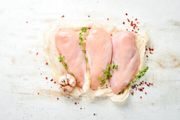 Meat. Raw chicken fillet with spices. Top view. Rustic style.
