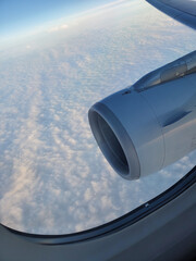 Beautiful photo above the clouds with horizon from plane view