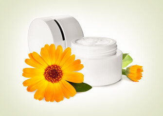 Body cream with calendula extract on light background. Natural based cosmetic product