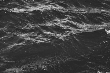 Wallpaper background of lapping river waves on water surface sea or ocean waves