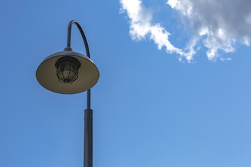 Vintage iron lantern in a public park in the daytime