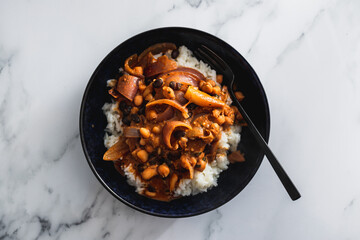 vegan chana masala sauce with chickpeas onion and with white rice, healthy plant-based food