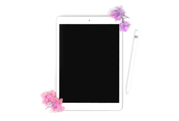 Empty screen tablet computer mock-up with floral dried flowers and pencil stylus, isolated on white background with copy space photo