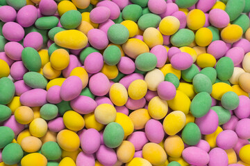 Group of colorful peanuts in glaze.