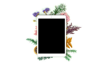 Fototapeta na wymiar Desktop workspace tablet mockup flatlay with floral dried flower frame composition concept, creative concept, copy space photo