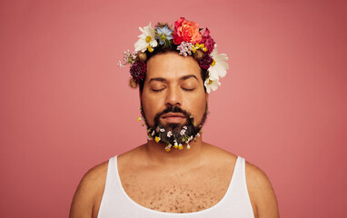 Gay man with flowers on head and beard